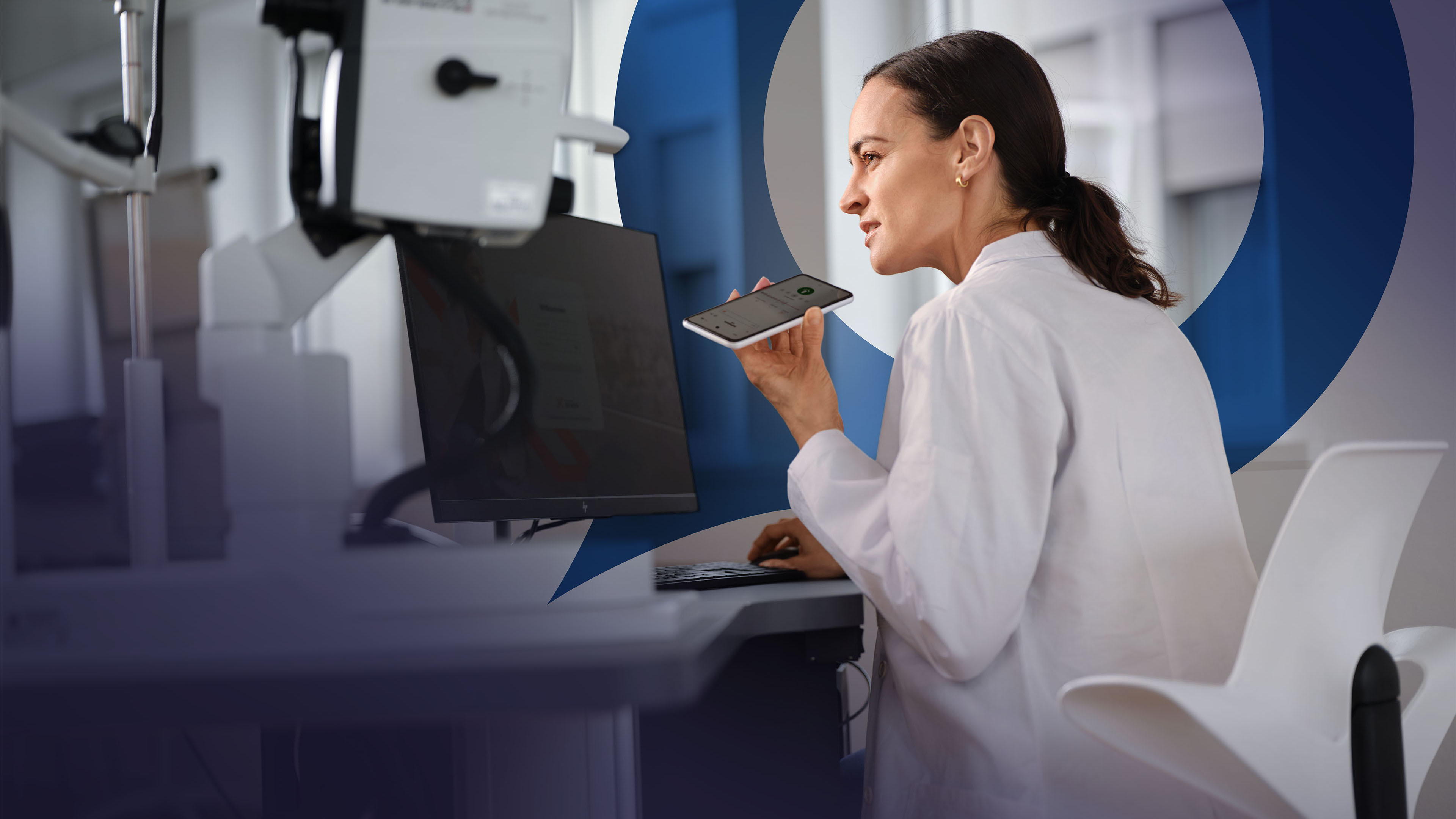 A doctor in a white coat dictates using a smartphone. The blue Voicepoint speech bubble is visible in the background.